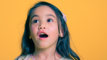 young girl looking up