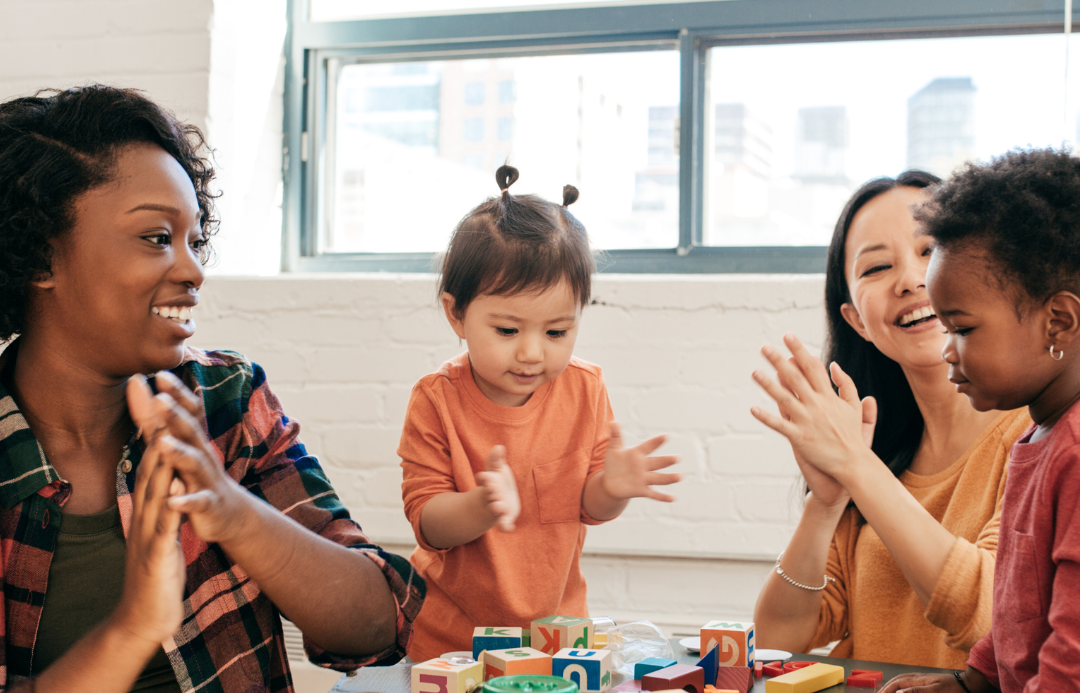 Child care teachers play with children