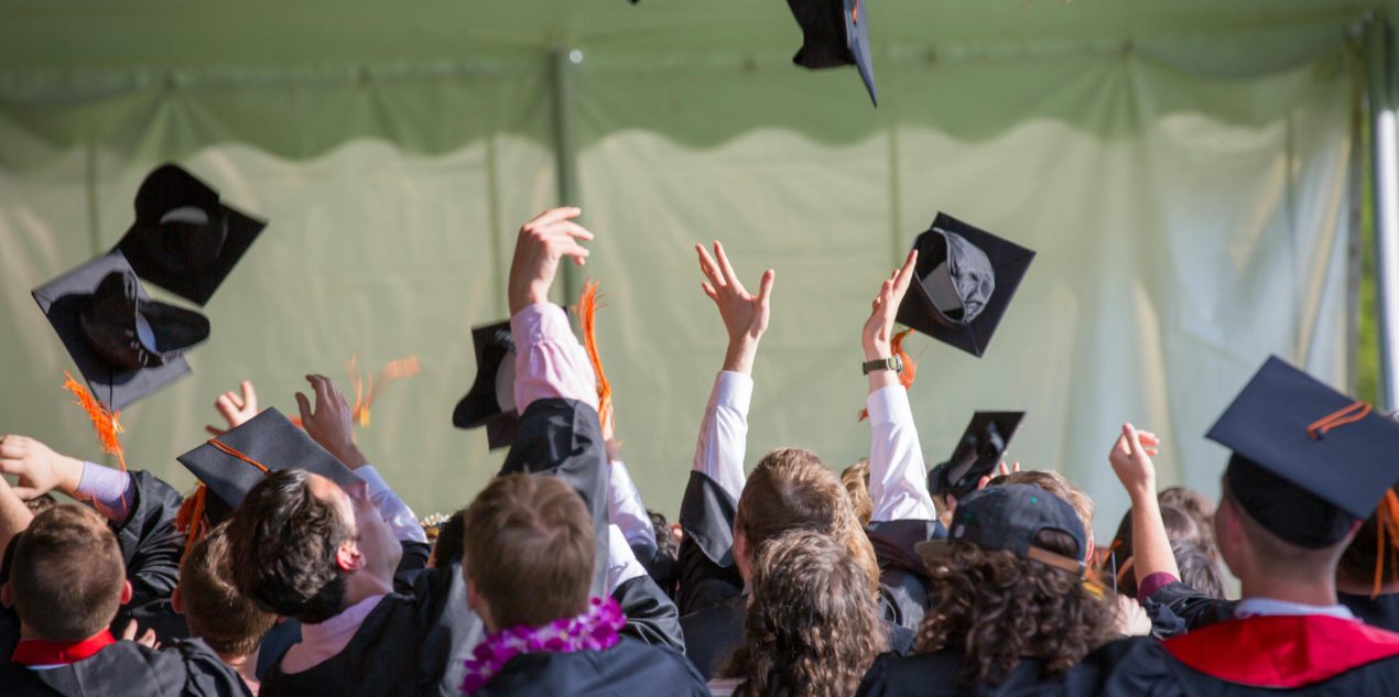 College graduation throwing caps
